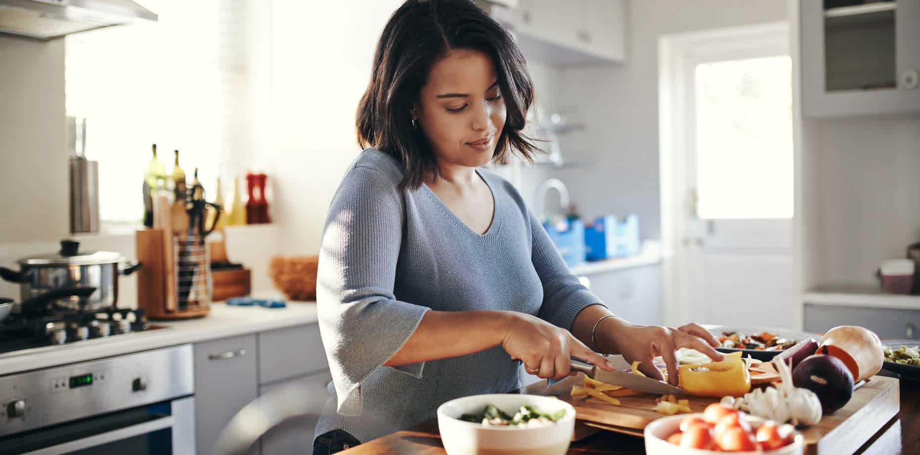 Woman in kitchen cooking