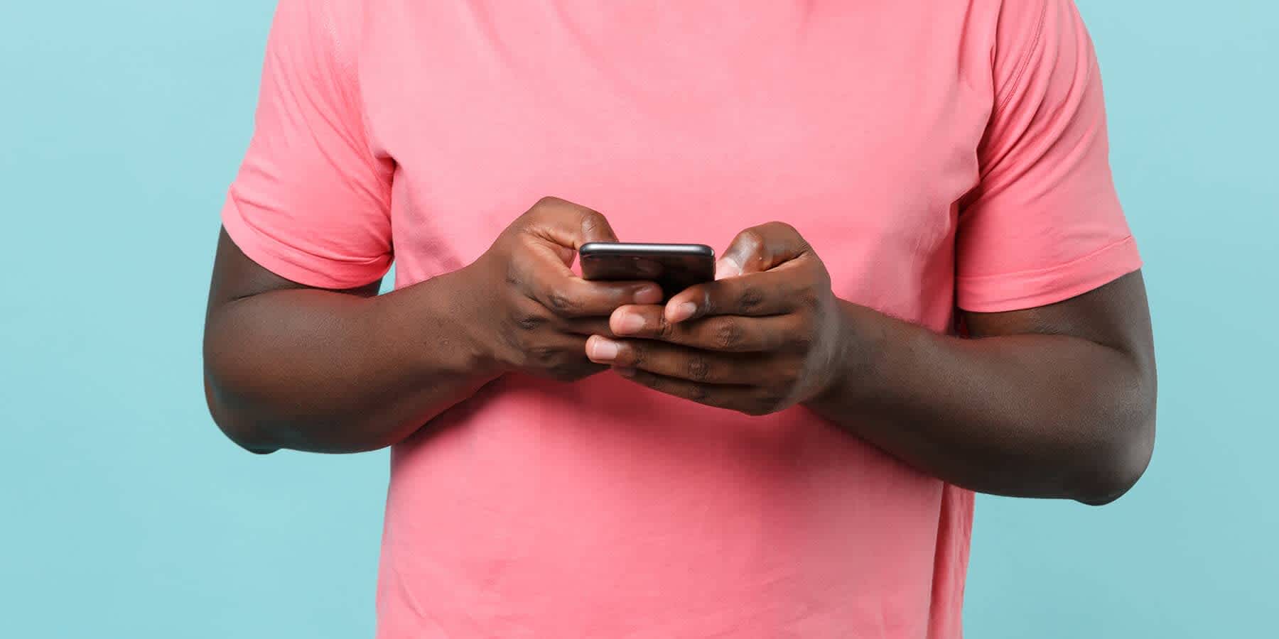 Man on mobile phone looking up if cholesterol can be too low