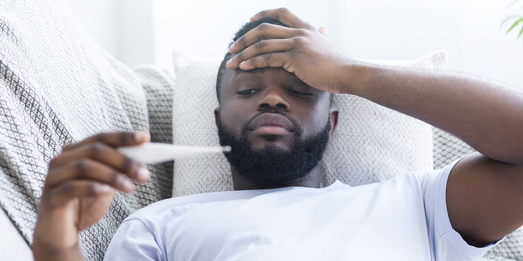 Young man experiencing inflammation and wondering whether salt causes inflammation