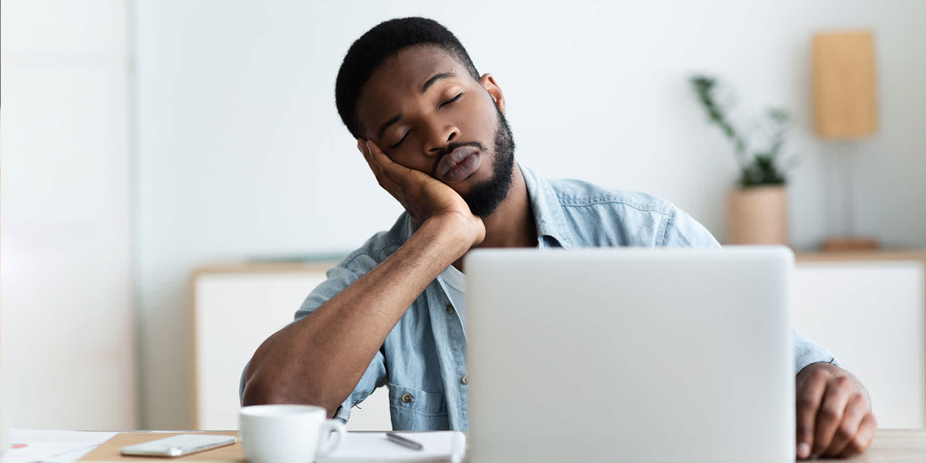 Tired man sleeping at desk