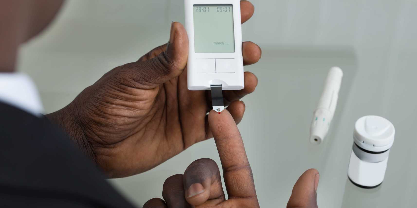 Man using glucometer for diabetes management