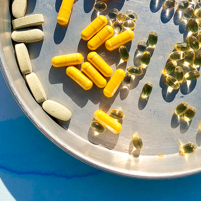 Plate filled with folic acid supplements