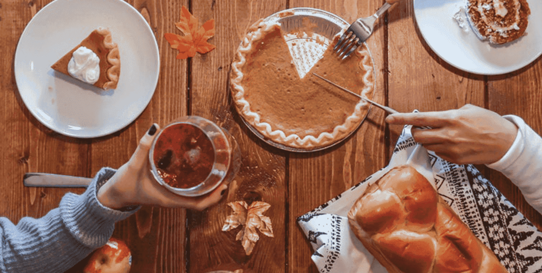 People enjoying Thanksgiving Day feast after cooking with Thanksgiving recipes for food sensitivities