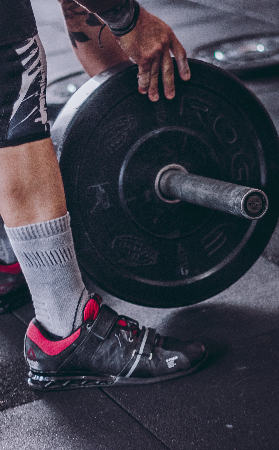 Man lifting weights and thinking about testosterone